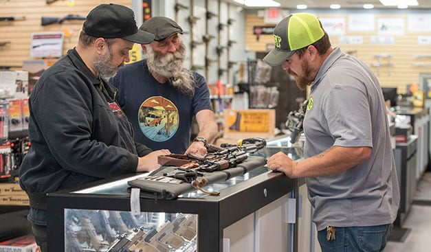 customers looking at guns